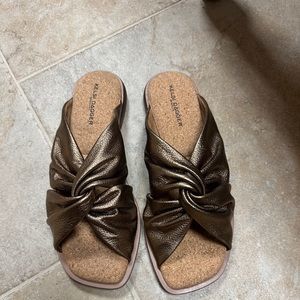 Never worn new in box. Soft bronze leather slides.